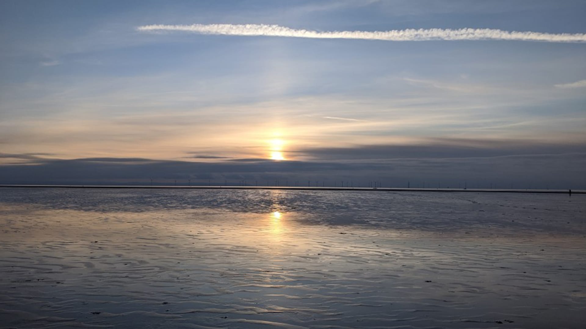 Sun set over beach mental wellbeing NLP